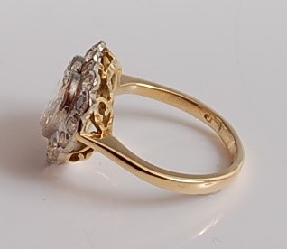 Lot 1226 - An 18ct yellow and white gold heart shaped...