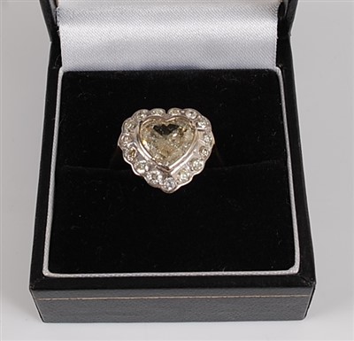 Lot 1226 - An 18ct yellow and white gold heart shaped...