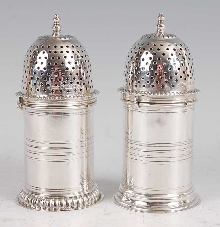 Lot 1167 - A matched pair of late Victorian silver sugar...
