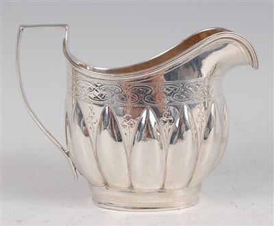 Lot 1095 - A George IV silver cream jug, of helmet form,...