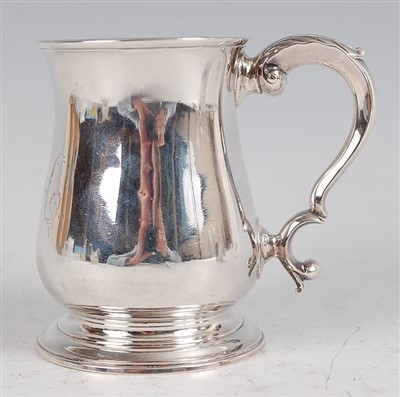 Lot 1096 - A George II silver bell shaped tankard, having...