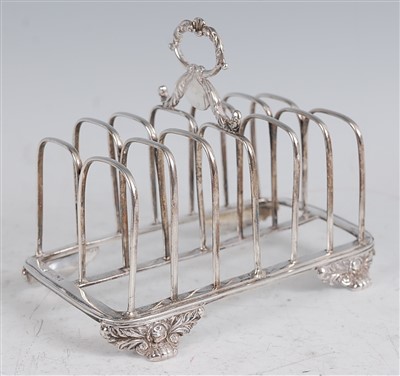 Lot 1107 - A George IV silver six division toast rack,...