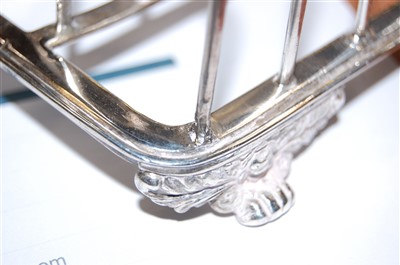 Lot 1107 - A George IV silver six division toast rack,...