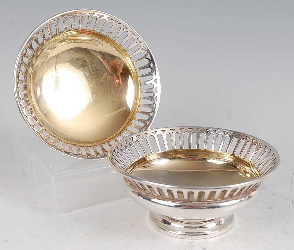Lot 1105 - A pair of Edwardian silver bonbon dishes, each...