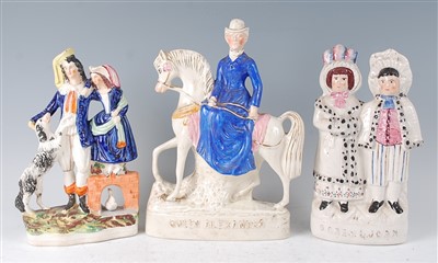 Lot 1052 - A Victorian Staffordshire figure group of a...
