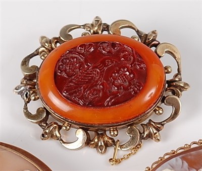 Lot 1204 - A 19th century yellow metal, carved agate and...