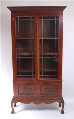 Lot 1481 - A circa 1900 mahogany bookcase on stand, the...