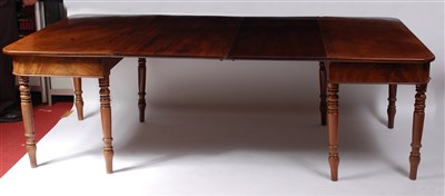 Lot 1455 - A Regency mahogany dining table, the D-ends...