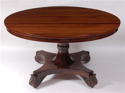 Lot 1453 - A late Regency rosewood circular snap-top...