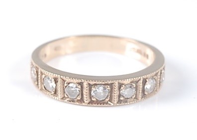 Lot 2596 - A 9ct yellow gold diamond half hoop eternity...