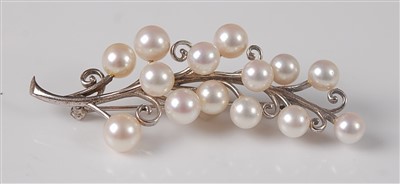 Lot 2616 - A white metal pearl set floral spray brooch,...