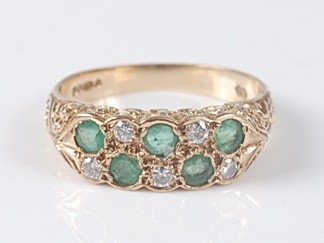 Lot 2640 - A 9ct yellow gold, emerald and diamond carved...