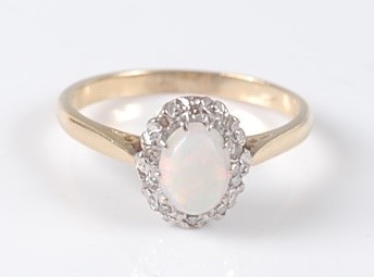 Lot 2639 - An 18ct yellow and white gold, opal and...