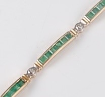 Lot 2646 - A yellow metal, emerald and diamond line...