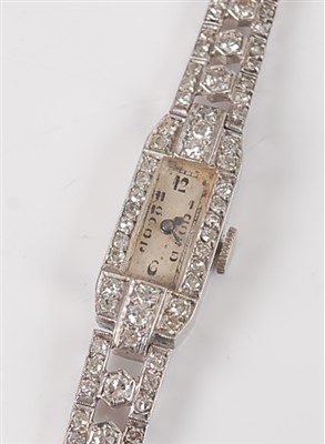 Lot 2647 - A 9ct white gold 15 jewel manual wind diamond...
