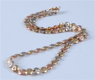 Lot 2620 - A 14ct three-colour gold flat circular link...