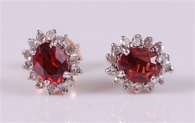 Lot 2627 - A pair of 9ct yellow gold, garnet and diamond...