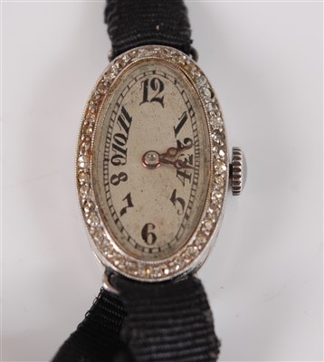 Lot 2628 - An Art Deco platinum manual wind cocktail...
