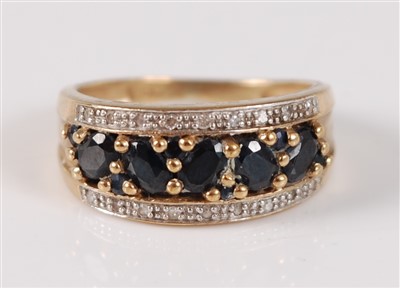 Lot 2663 - A 9ct yellow gold, sapphire and diamond half...