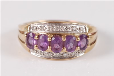 Lot 2666 - A yellow metal, amethyst and diamond three row...