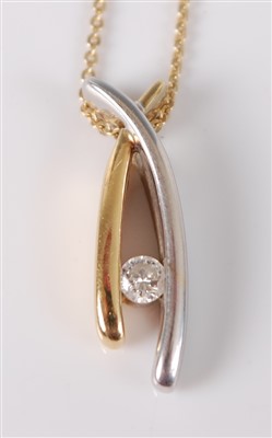 Lot 2668 - An 18ct yellow and white gold wishbone pendant,...