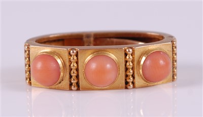 Lot 2669 - A yellow metal scarf clip, having three coral...