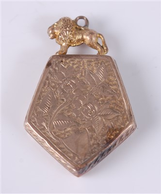 Lot 2671 - A yellow metal shield shaped locket, engraved...