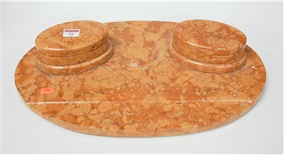 Lot 113 - An Art Deco rouge marble desk stand of oval...