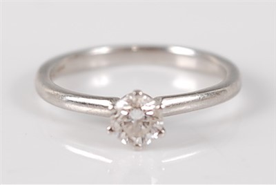 Lot 2673 - A contemporary platinum diamond solitaire ring,...