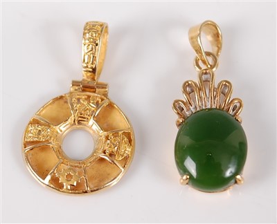 Lot 2680 - A Chinese yellow metal pendant, of ring shape,...