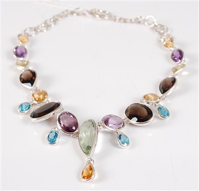 Lot 2712 - A contemporary silver multi-gem set fringe...