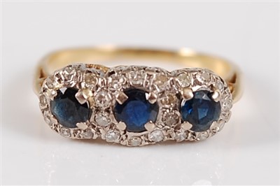 Lot 2685 - A yellow metal, sapphire and diamond dress...