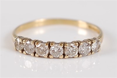 Lot 2688 - An 18ct gold diamond half hoop ring, arranged...