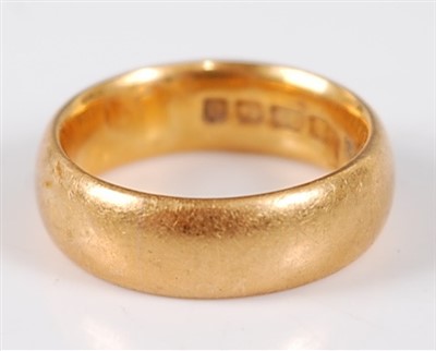 Lot 2742 - A 22ct gold wedding band, 11g, size M, w.6.5mm