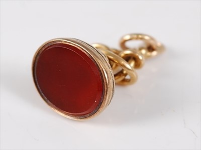 Lot 2756 - A yellow metal and carnelian set fob pendant,...