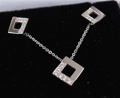 Lot 2747 - A pair of 18ct white gold diamond earrings...