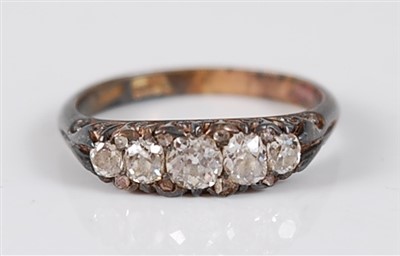 Lot 2738 - A yellow metal five-stone diamond half hoop...