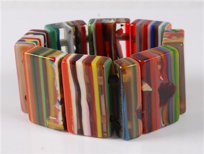 Lot 2767 - A banded and coloured lucite expanding...