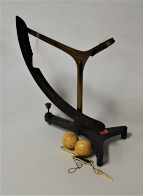 Lot 144 - A tailor's brass and iron cotton measure, the...
