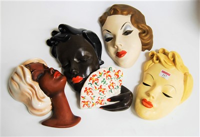 Lot 217 - A West German pottery wall mask of a lady in...