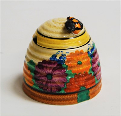 Lot 221 - A Clarice Cliff preserve pot and cover, in the...