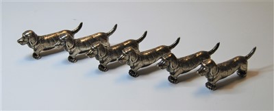 Lot 316 - A set of six silver plated knife rests, each...