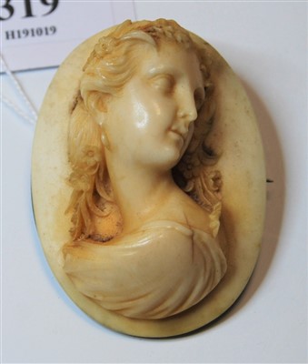 Lot 319 - A late 19th century ivory brooch, carved as a...