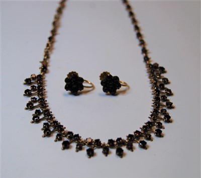 Lot 325 - An early 20th century yellow metal and garnet...