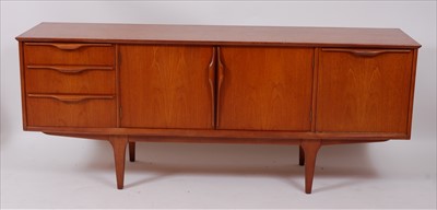 Lot 360 - A 1960s English teak long sideboard, having...