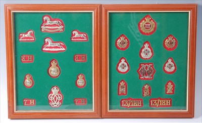 Lot 118 - A collection of cap badges, collar badges and shoulder titles