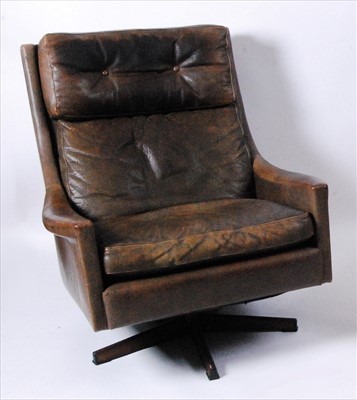 Lot 358 - A 1960s Danish tan leather upholstered swivel...