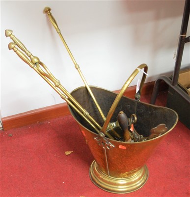 Lot 87 - A set of three turned brass fire tools,...
