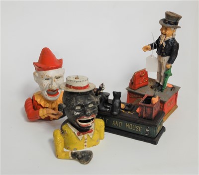 Lot 113 - A novelty cast iron cat & mouse moneybox...