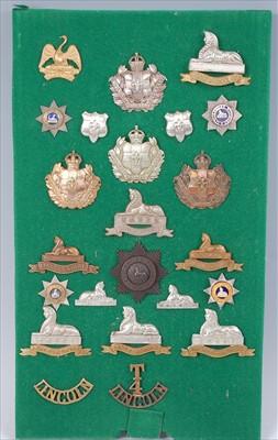 Lot 105 - A collection of cap badges, collar badges and shoulder titles